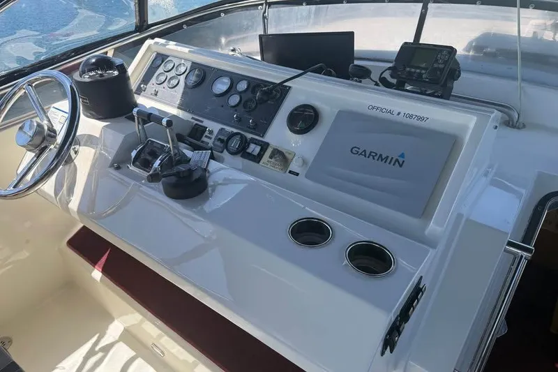 Slide: The Image of 1999 McKinna 57 Pilothouse helm with Garmin navigation system and control panel. - 6