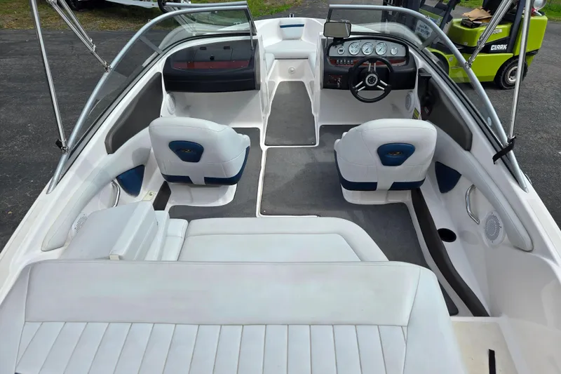 Slide: The Image of 2008 Regal 1900 Bowrider interior with white seating and modern dashboard. - 5