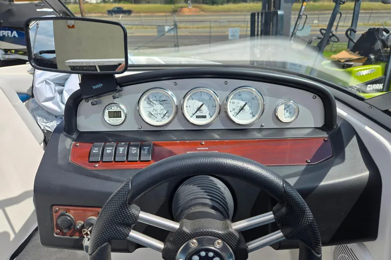 Slide: The Image of Dashboard of a 2008 Regal 1900 Bowrider boat with gauges and steering wheel. - 6