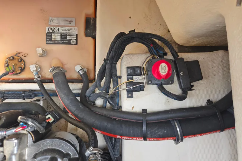 Slide: The Image of Engine compartment of a 2008 Regal 1900 Bowrider with wiring and fuel lines visible. - 7