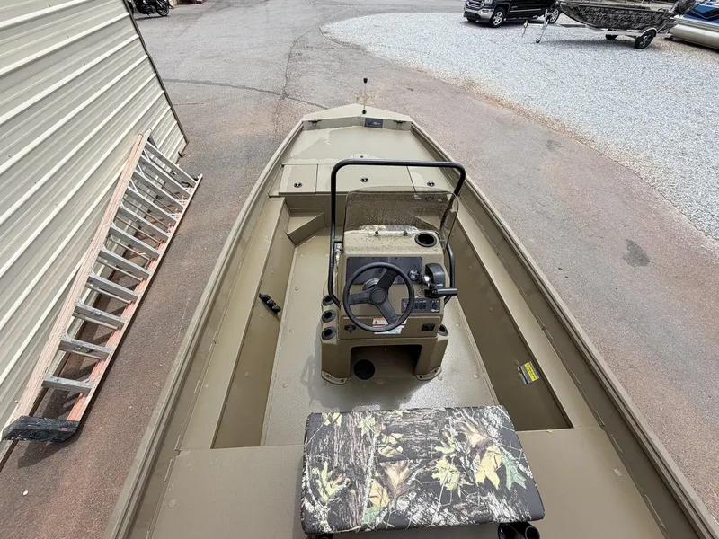Slide: The Image of 2026 G3 GATOR TOUGH 18CC boat, interior view, steering console, parked outdoors. - 4