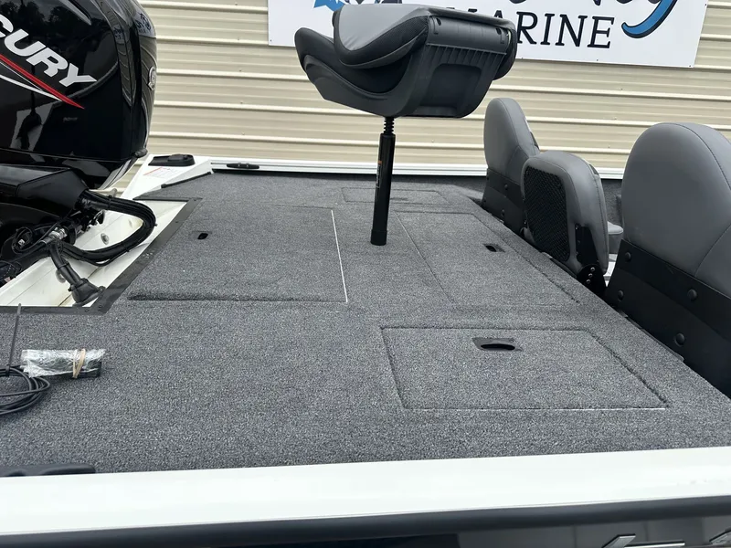 Slide: The Image of 2026 Lowe Stinger ST175 boat with gray carpeted deck and seating. - 8
