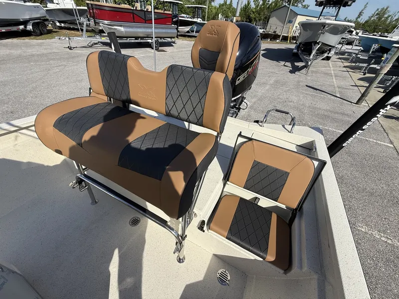 Slide: The Image of 2026 Xpress Hyper-Lift Bay Series H22B boat seats in brown and black design. - 11