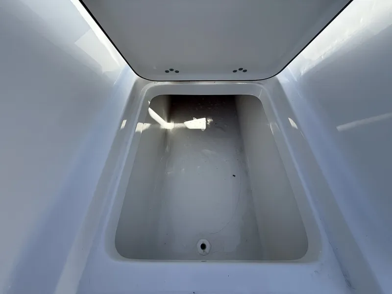 Slide: The Image of Interior view of 2026 Sea Pro 222 Center Console storage compartment. - 12