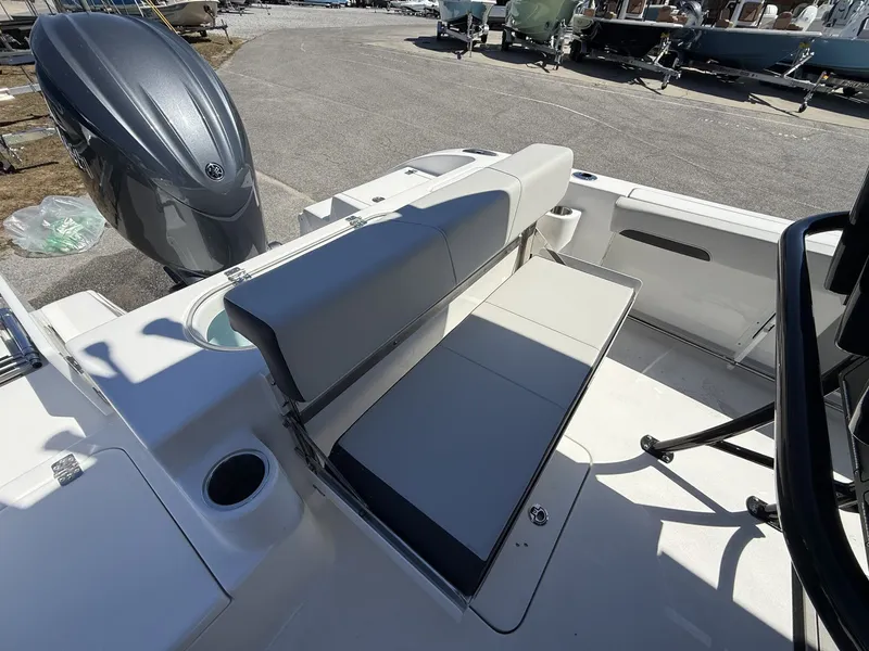 Slide: The Image of 2026 Sea Pro 222 Center Console with foldable seat and outboard motor. - 11