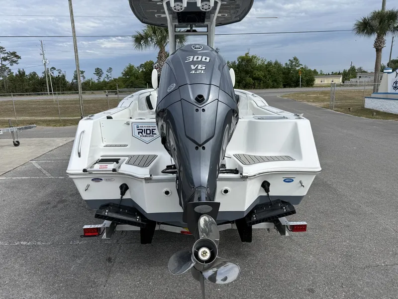 Slide: The Image of Rear view of 2026 Tidewater 232 CC Adventure with outboard motor. - 5