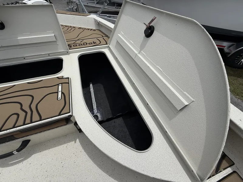 Slide: The Image of Xpress X23B Bay Lounge 2026 with open storage compartment lid. - 10