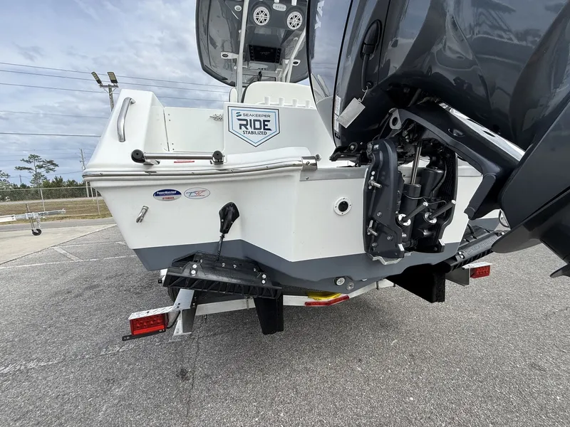 Slide: The Image of Rear view of 2026 Tidewater 232 CC Adventure boat on a trailer. - 4
