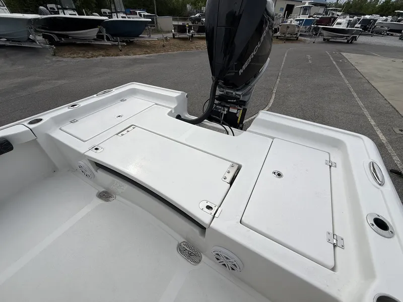 Slide: The Image of 2026 Tidewater 2300 Carolina Bay boat with motor, parked on a lot. - 14