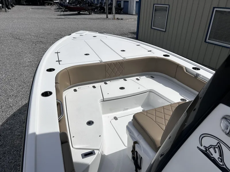 Slide: The Image of 2026 Blazer Bay 2440 boat with cushioned seating and storage compartments. - 5