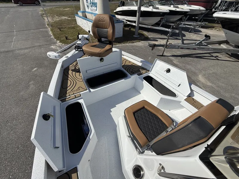 Slide: The Image of 2026 Xpress Hyper-Lift Bay Series H20B boat with open storage compartments. - 6