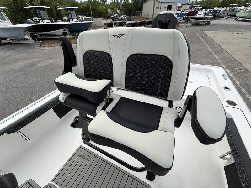 Slide: The Image of Tidewater 2300 Carolina Bay 2026 boat seats at a marina. - 15