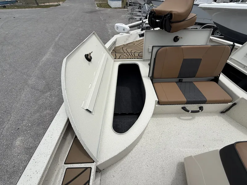 Slide: The Image of Xpress X23B Bay Lounge 2026 with open storage compartment lid. - 3