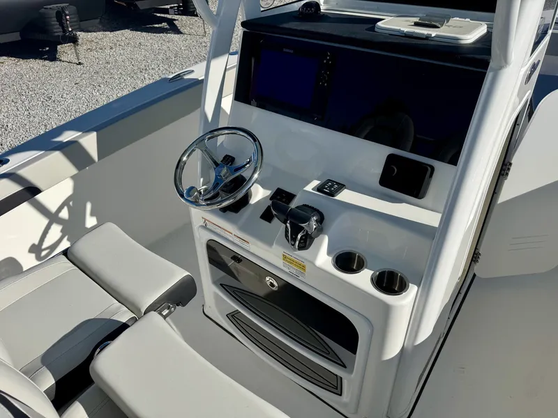 Slide: The Image of Interior view of Sea Pro 262 DLX 2025 helm station. - 10