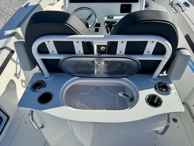 Slide: The Image of Interior view of 2025 Sea Pro 262 DLX with seating and helm. - 11