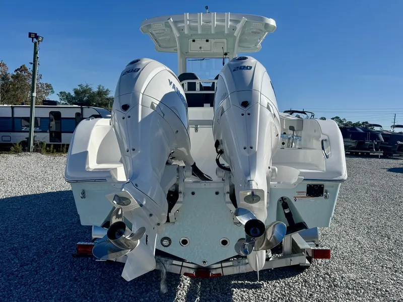 Slide: The Image of Rear view of 2025 Sea Pro 262 DLX with twin outboard engines. - 5
