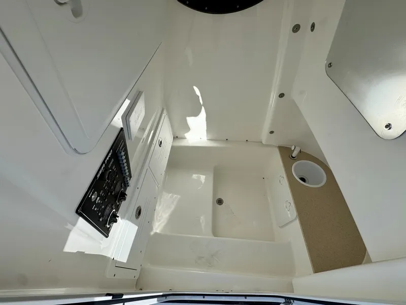 Slide: The Image of Interior of 2025 Sea Pro 262 DLX with controls and sink. - 9