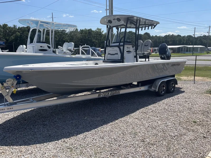 The Image of 2026 Sea Pro 250 Bay boat on trailer outdoors. - 1