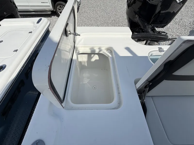 Slide: The Image of 2026 Sea Pro 250 Bay boat with open storage compartment. - 11