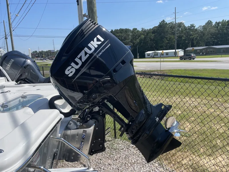 Slide: The Image of Suzuki outboard motor on a 2026 Sea Pro 250 Bay boat. - 13