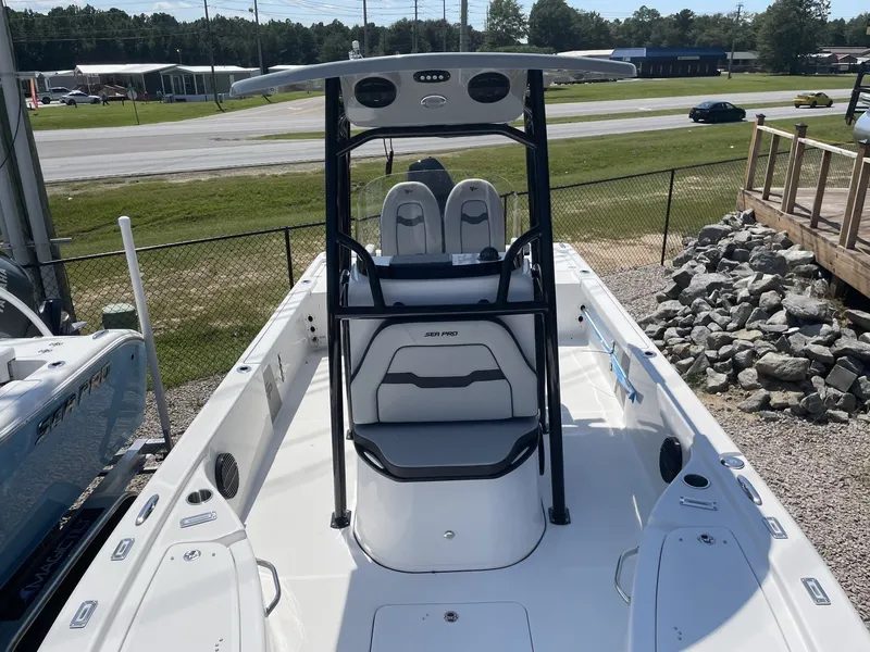 Slide: The Image of 2026 Sea Pro 250 Bay boat on a parking lot. - 16