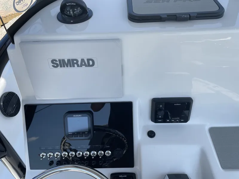 Slide: The Image of Dashboard of 2026 Sea Pro 250 Bay with Simrad display. - 18