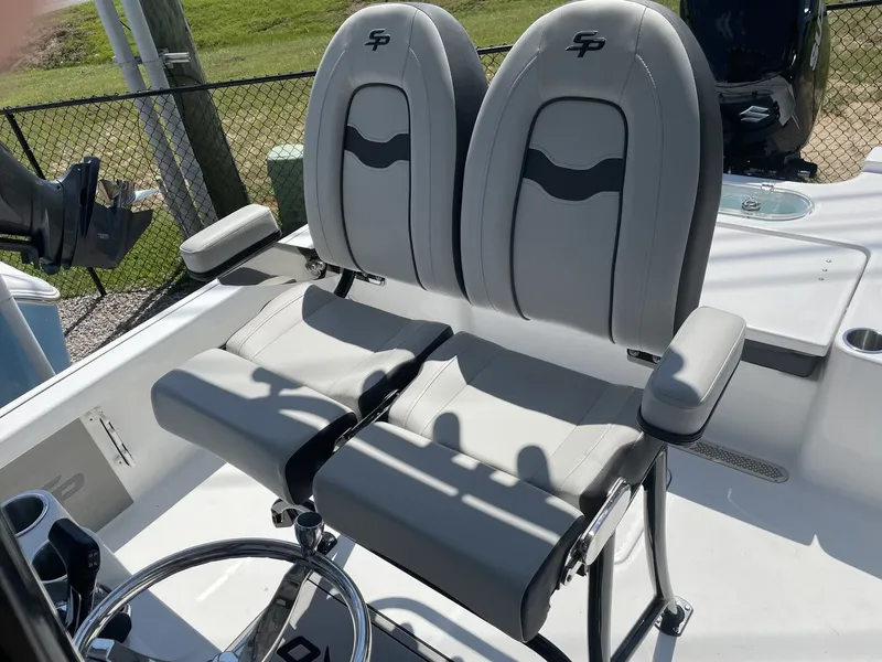 Slide: The Image of 2026 Sea Pro 250 Bay boat seats and helm station. - 20