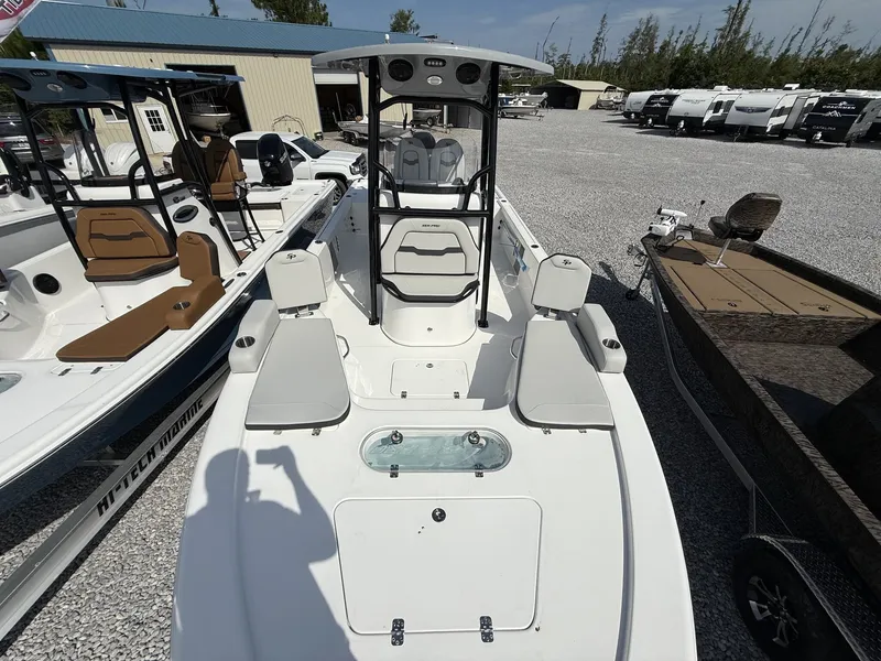 Slide: The Image of 2026 Sea Pro 250 Bay boat displayed on gravel lot. - 6