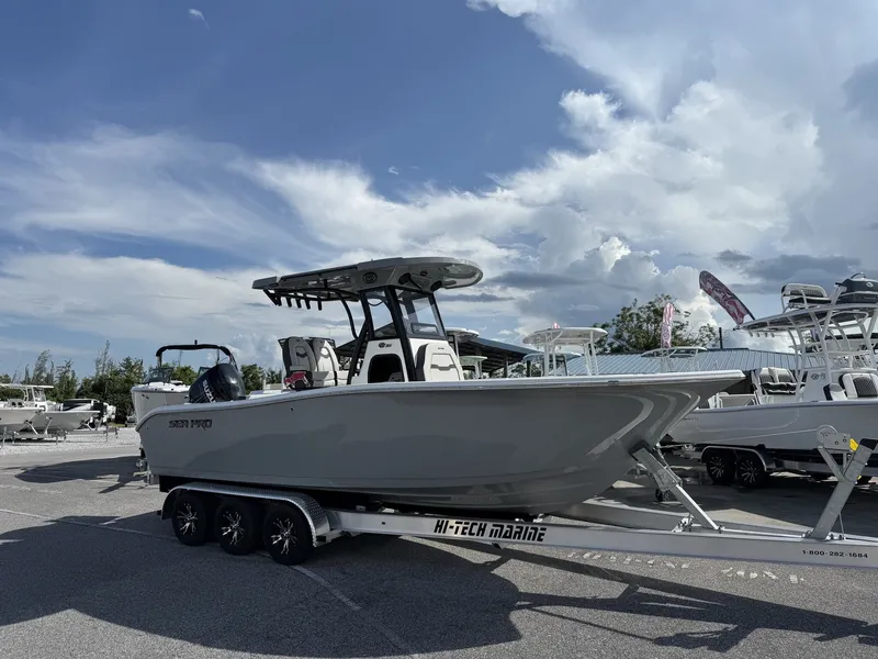 The Image of 2026 Sea Pro 242 boat on trailer under blue sky. - 1
