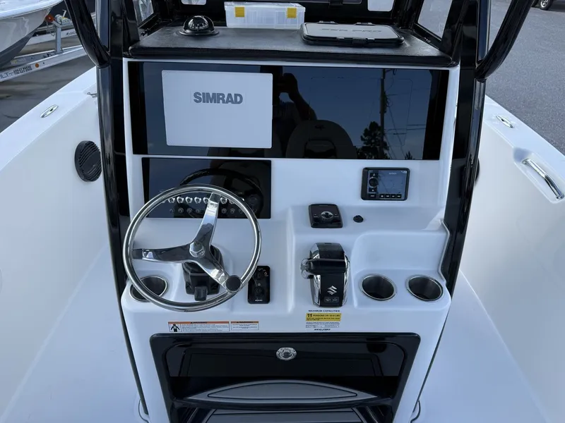 Slide: The Image of Sea Pro 242 boat helm with Simrad display, model year 2026. - 10