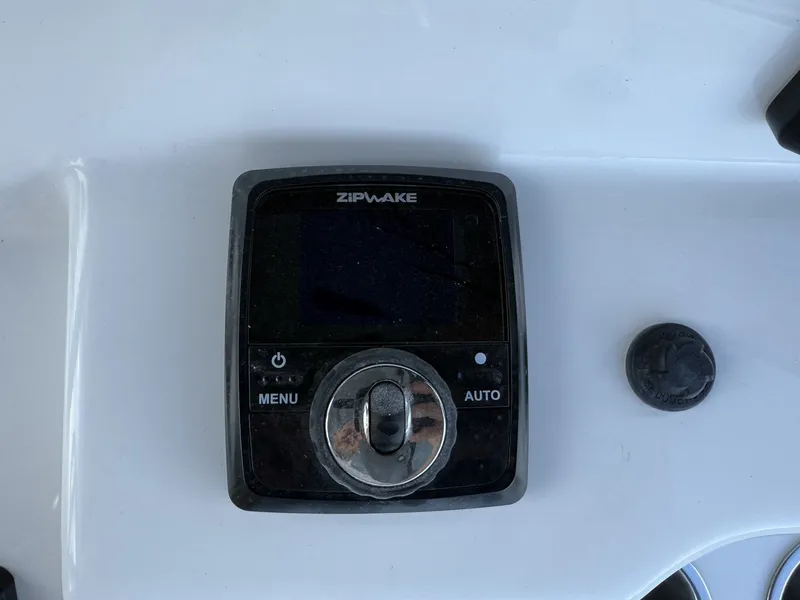 Slide: The Image of Zipwake control on Sea Pro 242 boat, year 2026. - 11