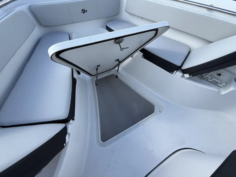 Slide: The Image of Interior view of Sea Pro 242 boat with storage compartment. - 3