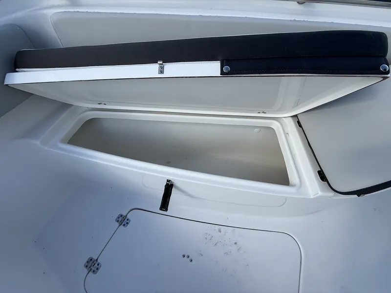 Slide: The Image of Open storage compartment in Sea Pro 242 boat, 2026 model. - 4