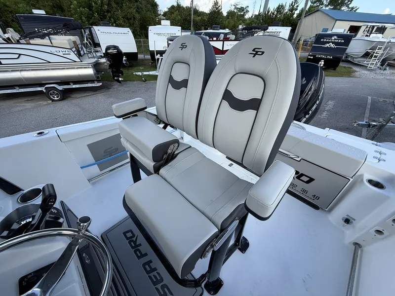 Slide: The Image of 2026 Sea Pro 242 boat with comfortable seating and helm station. - 9
