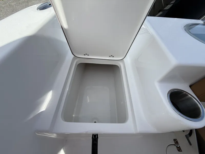 Slide: The Image of Open storage compartment on 2026 Sea Pro 222 Center Console boat. - 12