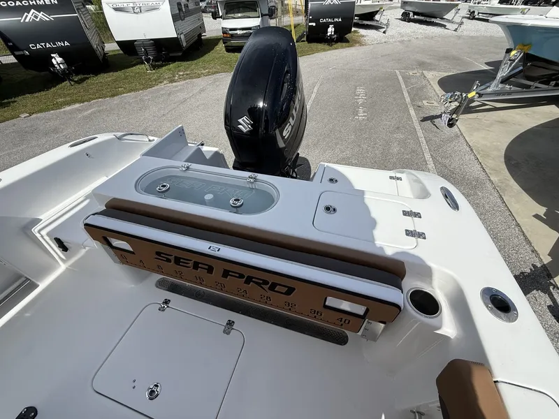Slide: The Image of 2026 Sea Pro 222 Center Console with Suzuki engine in a parking lot. - 14