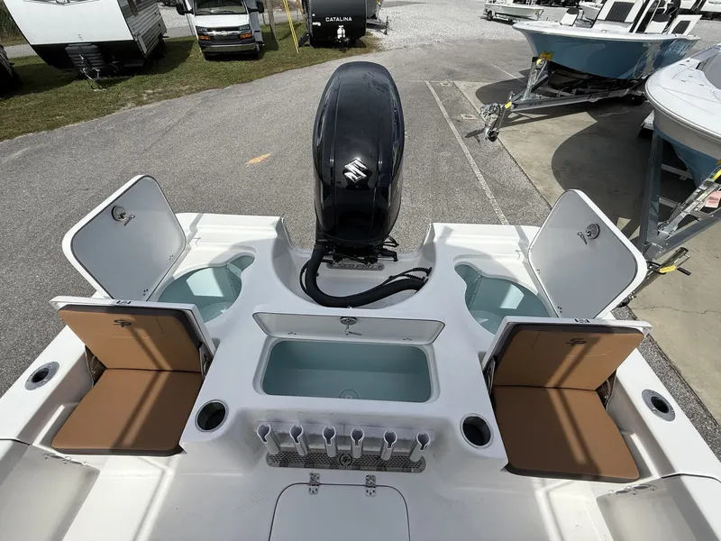 Slide: The Image of 2026 Sea Pro 230 Bay boat with engine and storage compartments. - 12