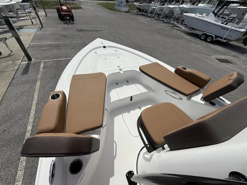 Slide: The Image of 2026 Sea Pro 230 Bay boat with brown seating at the dock. - 8