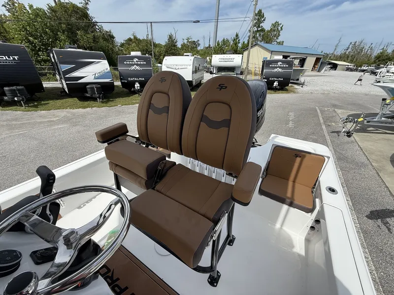 Slide: The Image of Interior of 2026 Sea Pro 230 Bay with brown seats. - 9