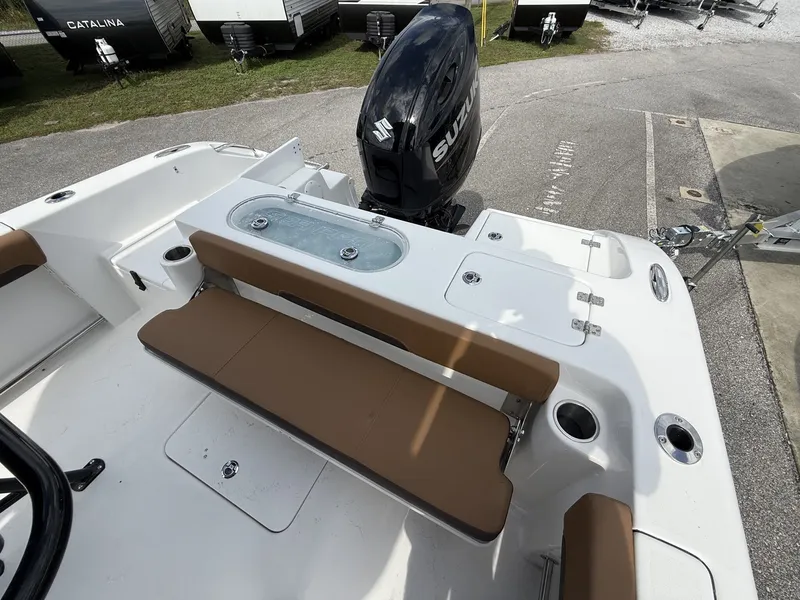 Slide: The Image of 2026 Sea Pro 222 Center Console with Suzuki engine, brown seating bench. - 11