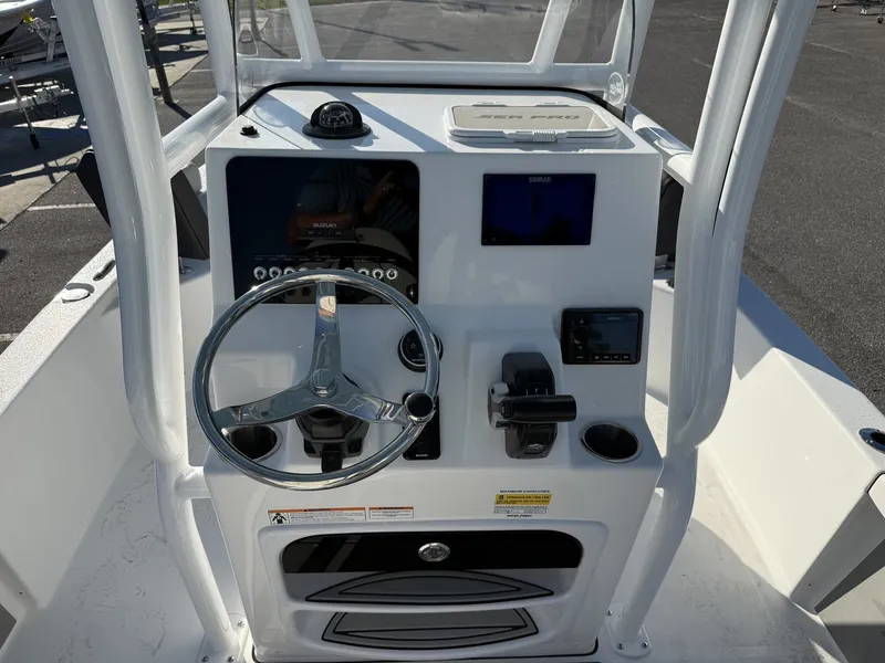 Slide: The Image of Steering console of the 2026 Sea Pro 230 Bay boat. - 6