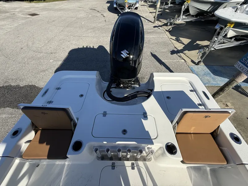 Slide: The Image of Rear view of 2026 Sea Pro 230 Bay with engine and storage compartments. - 14