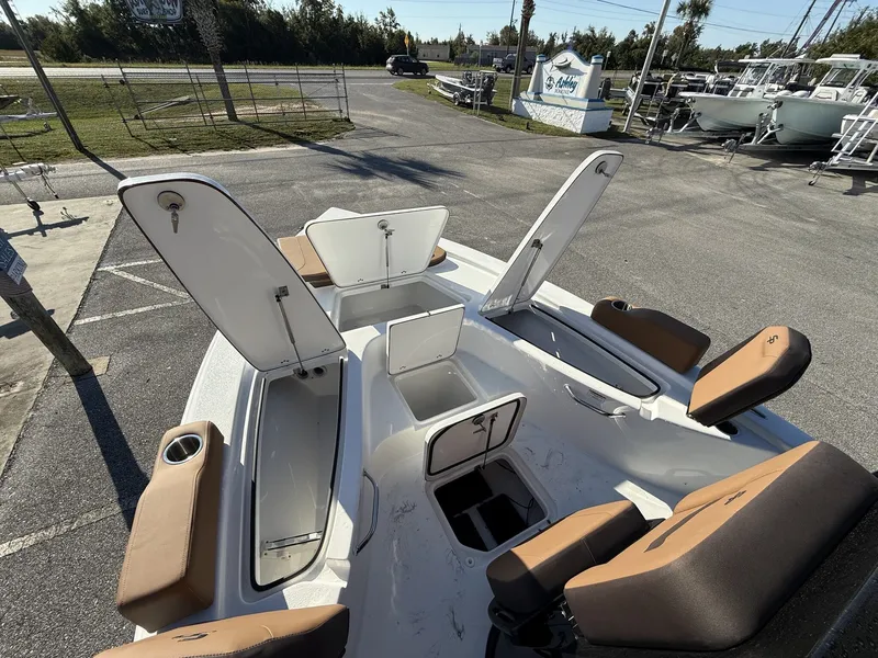 Slide: The Image of Interior view of 2026 Sea Pro 230 Bay with open storage compartments. - 6
