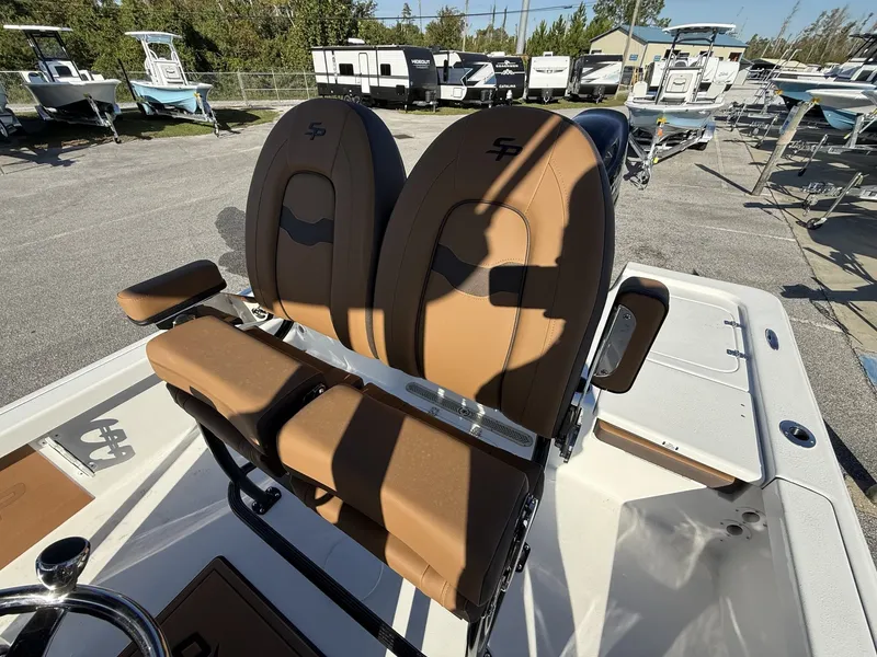 Slide: The Image of 2026 Sea Pro 230 Bay boat with brown seats outdoors. - 8