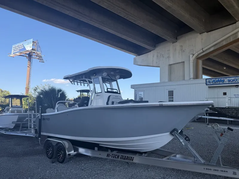 The Image of 2026 Sea Pro 245FLX R boat on trailer under bridge. - 1