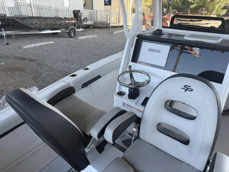 Slide: The Image of Interior view of 2026 Sea Pro 245FLX R with helm console. - 13