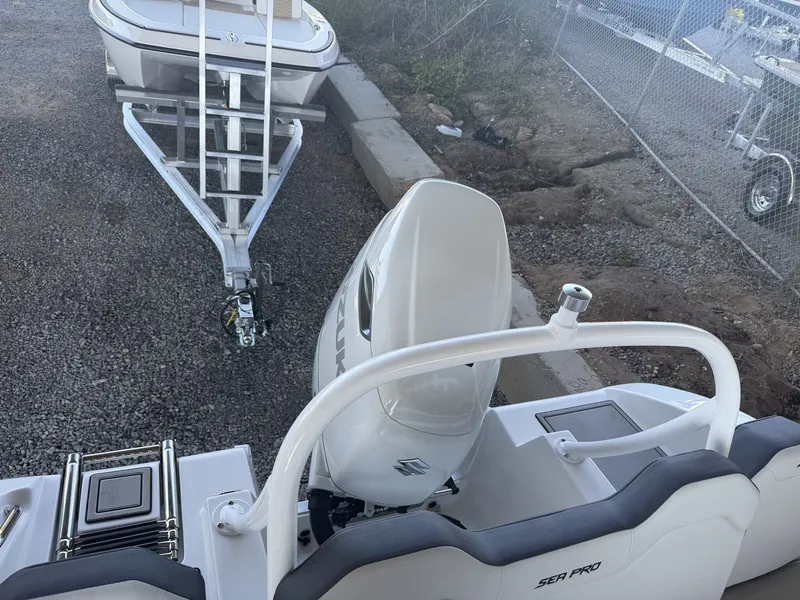 Slide: The Image of 2026 Sea Pro 245FLX R boat with Suzuki outboard motor. - 14