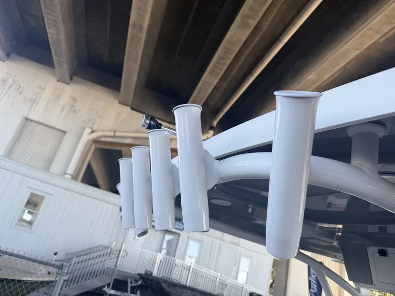 Slide: The Image of Close-up of fishing rod holders on a 2026 Sea Pro 245FLX R boat. - 15