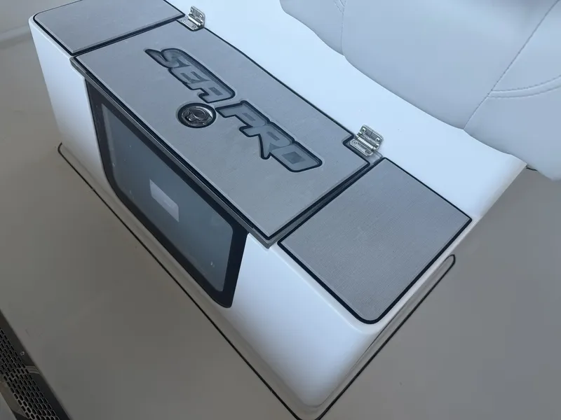 Slide: The Image of Sea Pro 245FLX R 2026 boat compartment with logo. - 16