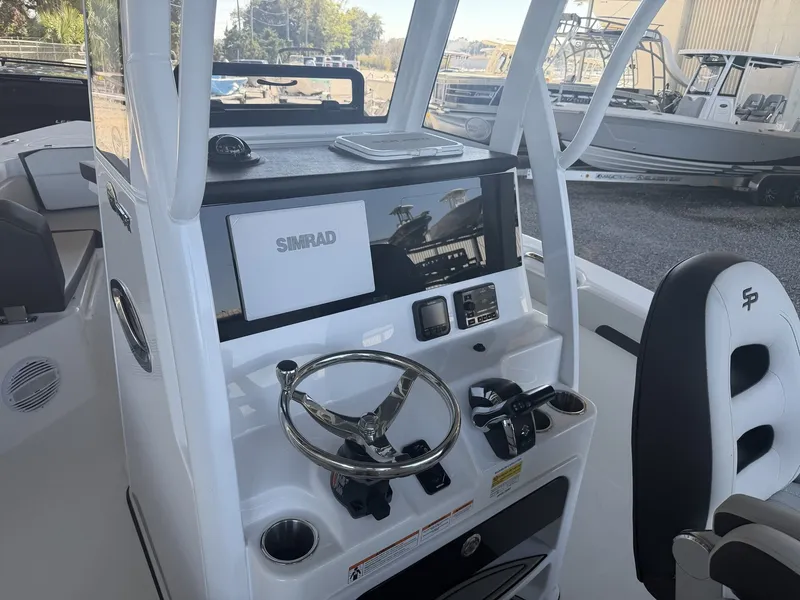 Slide: The Image of Interior view of Sea Pro 245FLX R 2026 with Simrad controls. - 21